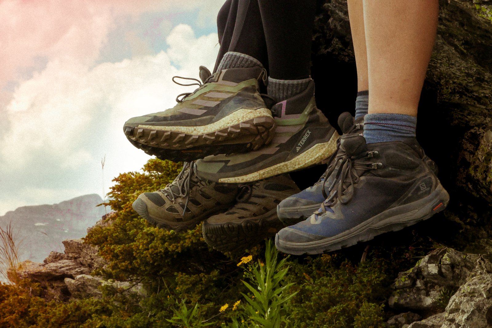 Hiking boots dangling over a ledge