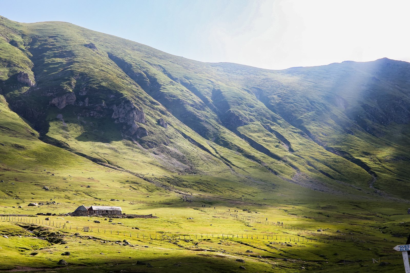 Sunlight across a wide green valley