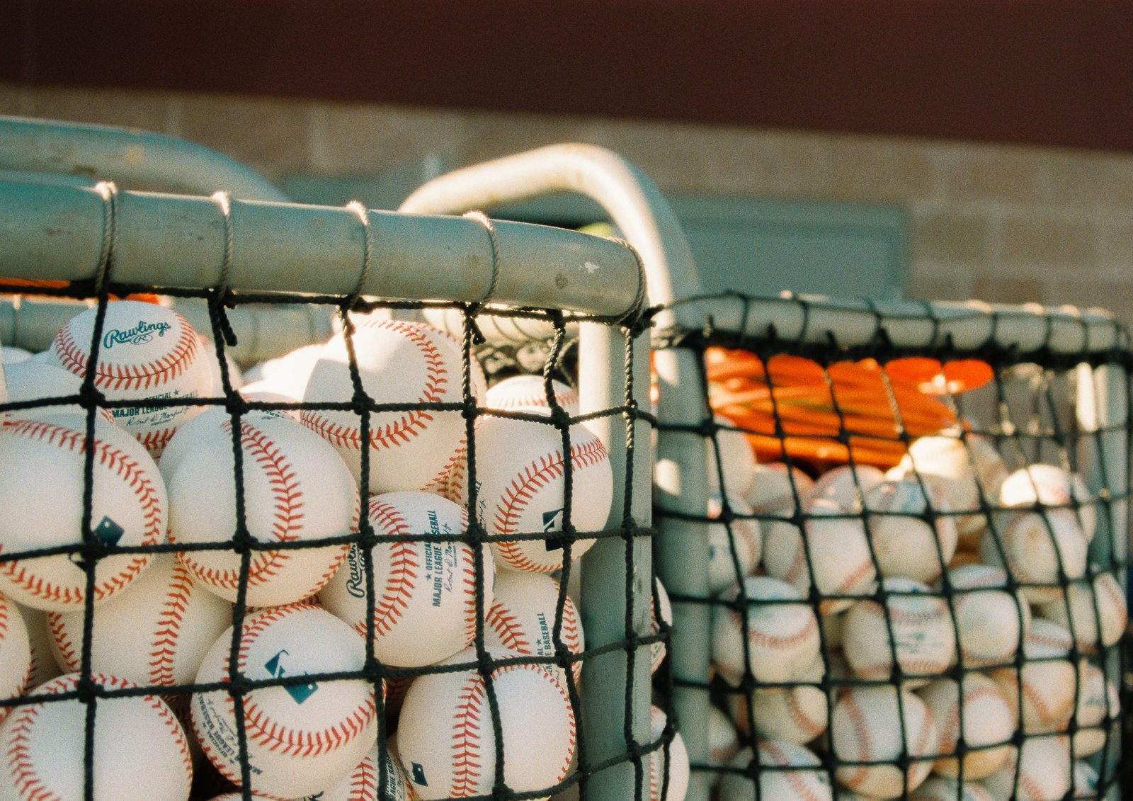 Baseballs in practice-ball cages