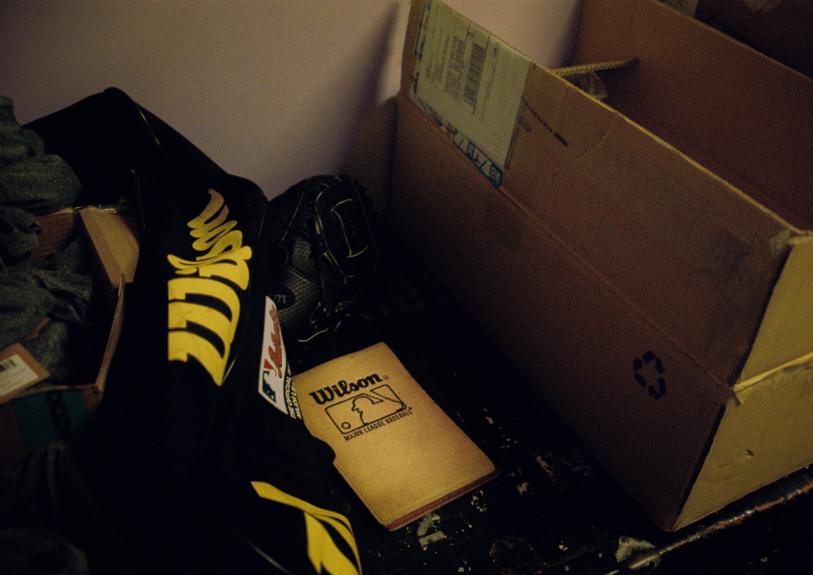 A Wilson shirt and glove box in a cardboard carton