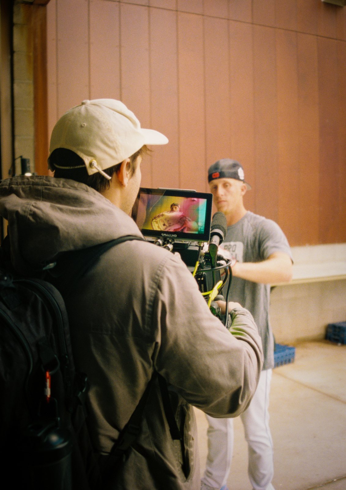A camera operator filming an interview