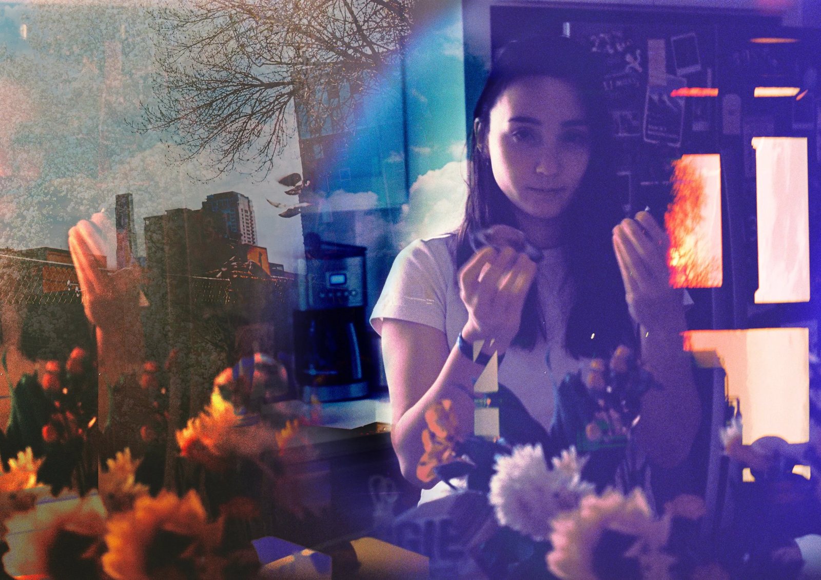 Double exposure of a woman at a table and a city skyline